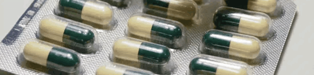 Blister pack of green and beige Librium capsules, a prescription benzodiazepine used to treat anxiety.